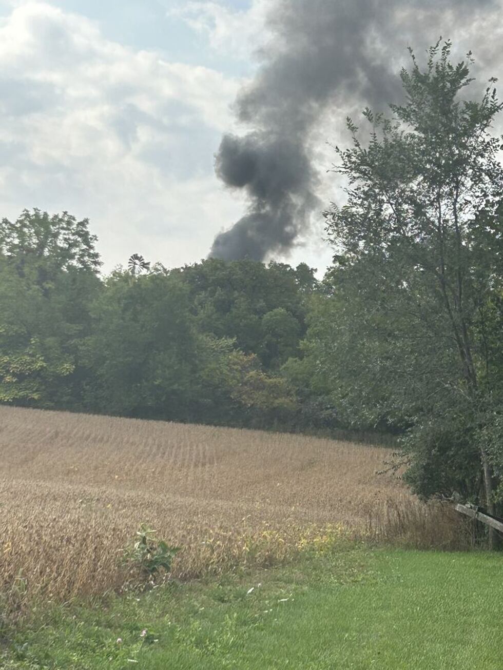 Plume of smoke seen Saturday morning, while officials worked to dispose of dynamite in the...