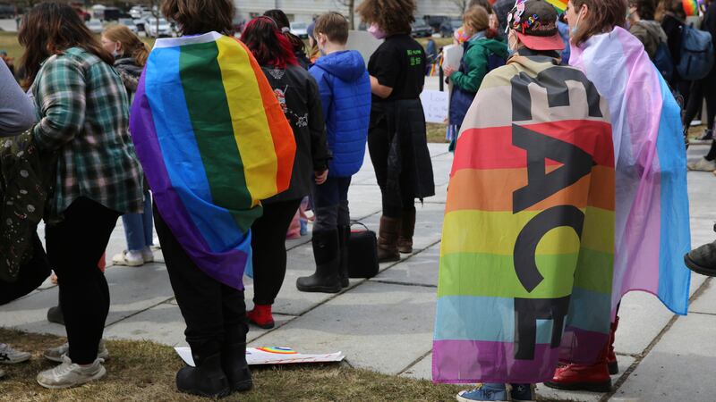 Hundreds of people gather on the lawn of the Vermont Statehouse in Montpelier, on Friday March...