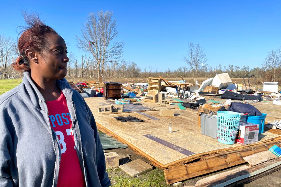 Kimberly Berry looks at what's left of her home outside Anguilla, Miss., Saturday, March 25,...