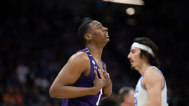 Northwestern guard Chase Audige (1) reacts after being whistled for a foul as he walks past...