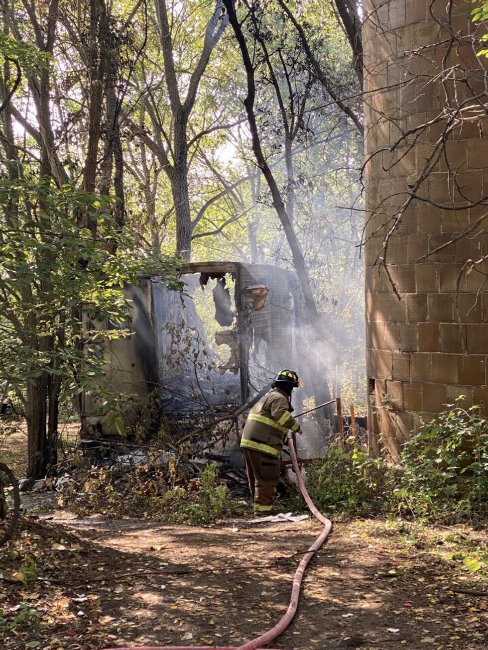 A firefighter works the scene of a dynamite disposal in the Town of Newark Saturday.